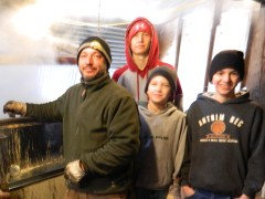 Dan Comte inside the sugarhouse on March 23, 2013 with his three sons, Tyler, Anthony and Andrew.