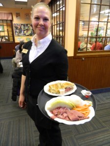Melissa Henry serves a corned beef & cabbage dinner.