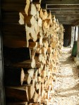 Cords of wood stacked at the sugarhouse that converted from a barn.
