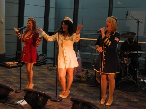 As part of a patriotic welcome home for the WWII vetrans, the Glamour Girls sang tunes from the 1940s.