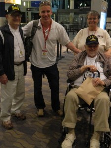 American Warrior Founder Chris Coutu and his assistant Sue Ponder shown with WWII veterans who took the April 27, 2013 Day of Honor trip.