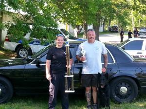 Courtesy photo: At the 2013 Region 4 USPCA Trials, shown holding therr trophies - Alyassa Larson shown with Officer Steve Vesco and Iko.