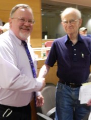 Mayor Donald Trinks is congratulated by Leonard Swade.