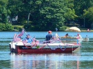 Showing patriotic spirit in the 2013 Lake Hayward Days Boat Parade.