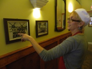 Kim shows a photo of her father who served as a gunner in WWII.