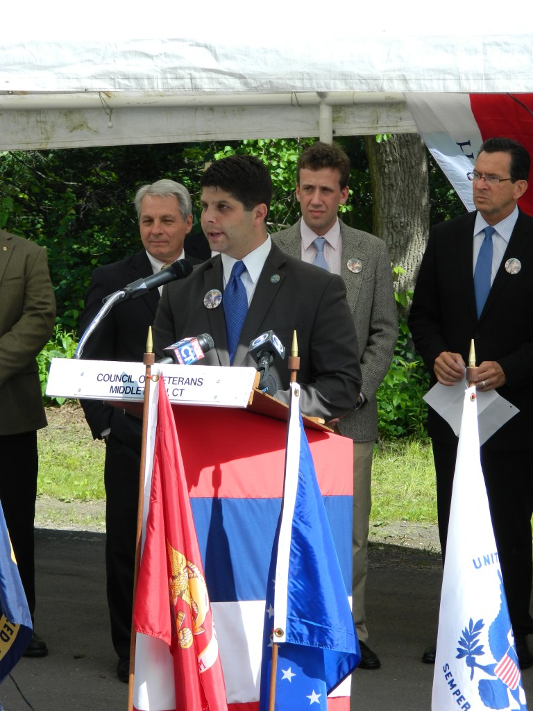 Photo by Jacqueline Bennett Joined by gov. Dannel Malloy and other dignitaries, Middletown Connecticut Mayor Daniel Drew spoke during the announcement of the selection of Vetrans Memorial Park in June 2012, 