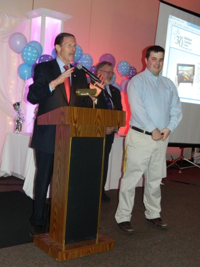 U.S. Senator Richard Blumenthal shown with his new friend Matt Glad and Mayor Donald Trinks agreed to double his donation at the Windsor Chamber Cares Benefit Auction on April 4.