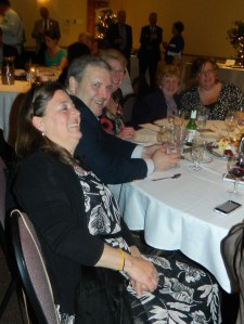 At the Walsh table, Ann Walsh (second from left) and friends enjoy the evening.