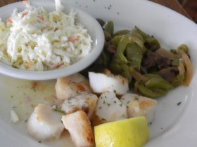 Scallops with sauteed mushroom mix and coleslaw.