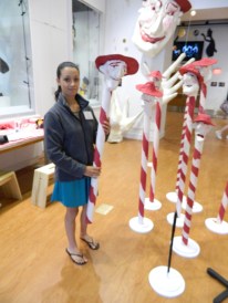 Museum Assistant Kiara Gonzalez shows a hands-on opportunity at the puppetry museum. 
