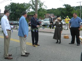 Manchester, Connecticut Mayor Jay Moran cuts the ribbon June 14 to begin a community march along Hartford Road to  "The Great Lawn" of the Cheney Mansions to commemorate the 100th anniversary of Homeland/Heritage Day.