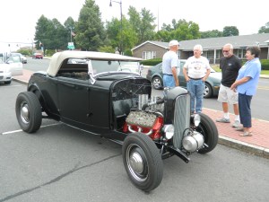 Not everyone got the news that the August 3 Cruisin on Main was postponed due to weather to August 10 - this classic car owner from tolland, CT showed up anyway.