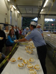 Ashley McCauley of Vernon waits in line for a bowl of peach shortcake.
