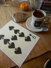 Large sized playing cards are handed out to alert servers where to deliver orders.