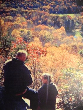 Photo by Michelle Larned Mike and Melane enjoy the beauty of New England foliage from atop a mountain at Devil's Hopyard in East Haddam, Conn.