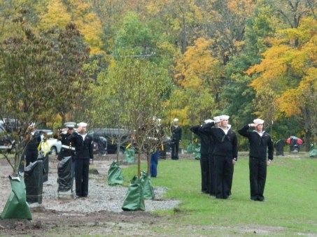 Photo by Jacqueline Bennett Preparing to unveil the CT Trees of honor plaques.