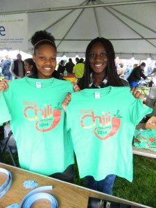 Abigail Redway and D'Andrea Koduak show the 2014 Chili Challenge t-shirt design.