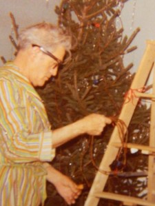 Dad untrimming our Christmas Tree the year my sister Candy and I gave him a new ladder as a gift - see the red curling ribbon tied around it.