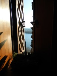 A peek at the majestic Connecticut River from a window in the  library at Gillette Castle - note the intricately carved wooden shutters.