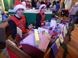 Santa's elves - Bryan Koski Bissonette of East Hartford and Megan Kelting of Tolland - were hard at work.
