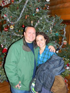 John Graning and Sunny Foote pose for a photo in front of the 15-foot Christmas Tree.