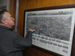 Dennis Gleeson shows a map depicting the impact the Cheney Brothers silk mills in Manchester, CT had on the growth and development of the town.