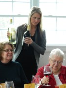 Beautiful Maryann pours the wine.
