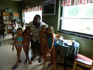 After a canoe ride on the Farmington River with their moms, Maya Donzella, Taylor Krapalis, Casey Krapalis and Hannah Donzella, all of windsor, met Chris Baker. Baker