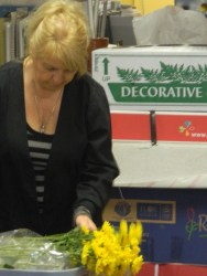 Shirley wraps daisies. 
