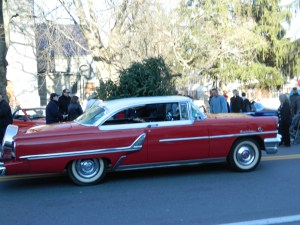 As seen in Rockwell's illustration - a 1955 red Mercury with Christmas Tree on top.