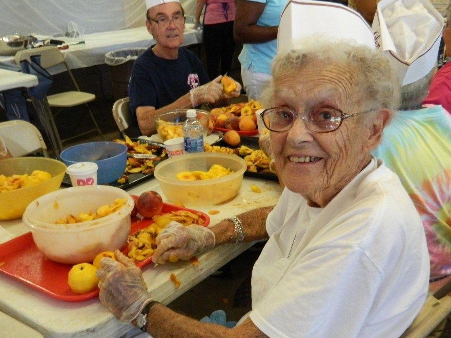 Photo by Jacqueline Bennett  Jan Adams, 93, has been cutting peaches for the annual Eighth Utilies District fire Department Peach Festival for 40 years.