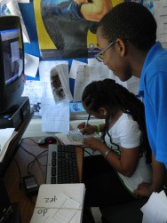 Enia Jubrey with students researching the victims of 9/11 in order to decorate luminaries for the 2011 "Walk of Light".