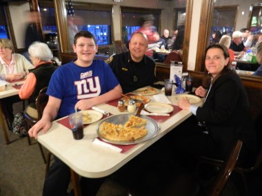 Sgt. Bernie Petkis, his son Evan and wife Lisa.