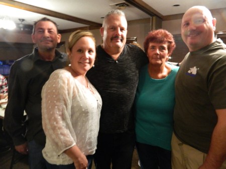 The folks who made it happen ..Officer Steve Vesco surrounded 2/24/2017 at Jim's Pizza, Windsor, CT by colleagues and friends who spearheaded a gofundme campaign and fundraiser to help K-9 Iko - Wayne and Kimberly Cabral, Debbie Samsom and Mark Rudiweic.